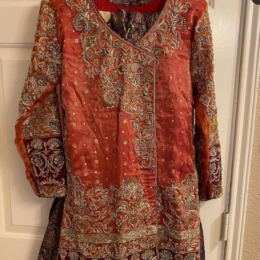 Pakistani designer SRA inspired dress with sharara heavy embroidered shirt.